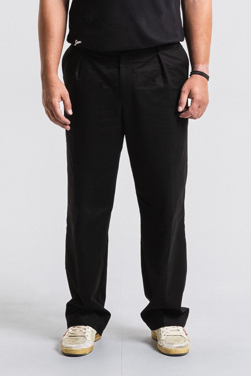 SEAM Poplin Pleated Trouser in Black, front view showing pleated silhouette