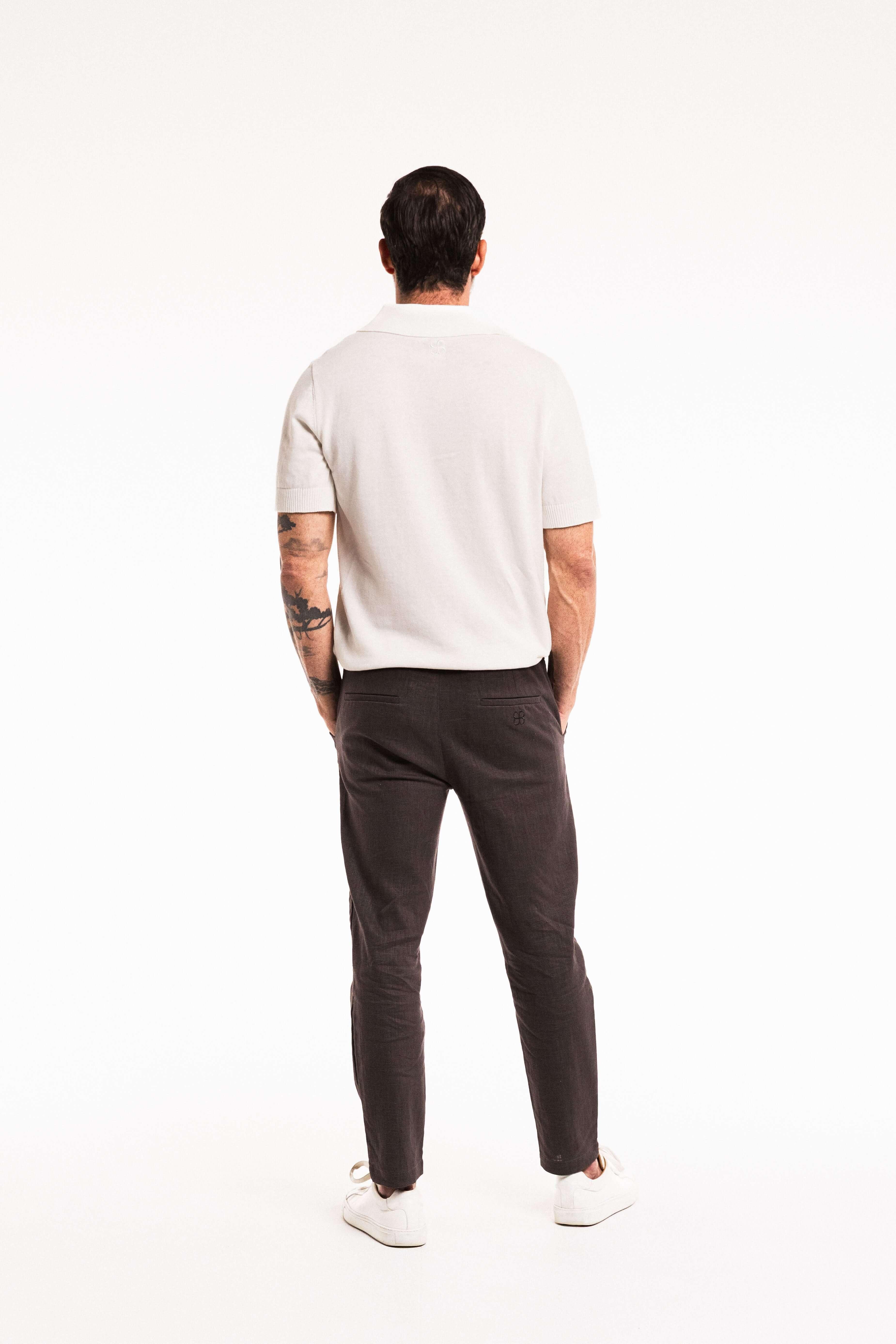 Man wearing Tailored Lounge Linen Pant in Charcoal, featuring a relaxed fit and straight-leg cut.