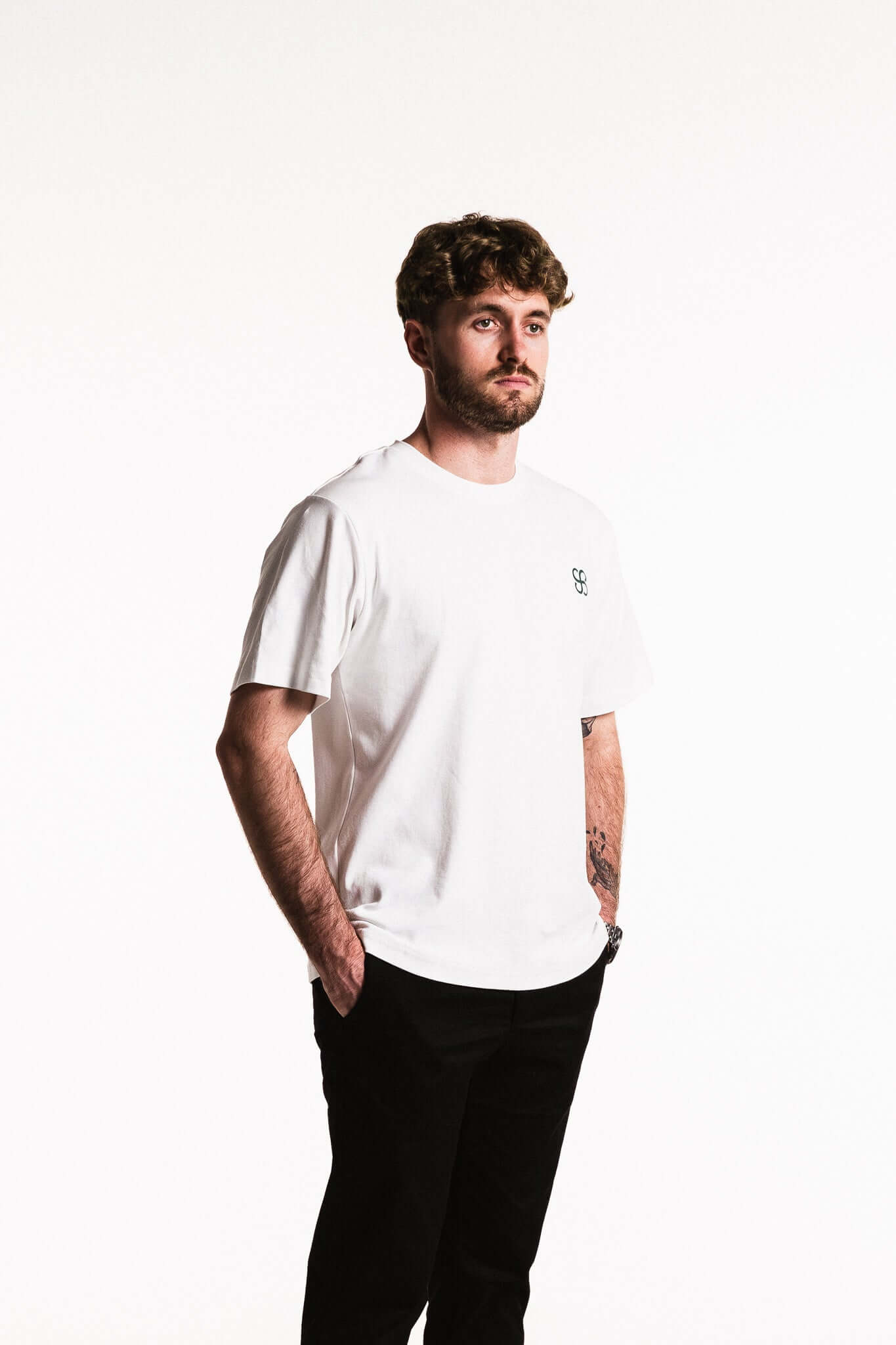 Cotton Typeface T-Shirt worn by a model, featuring a white design with minimal chest branding.