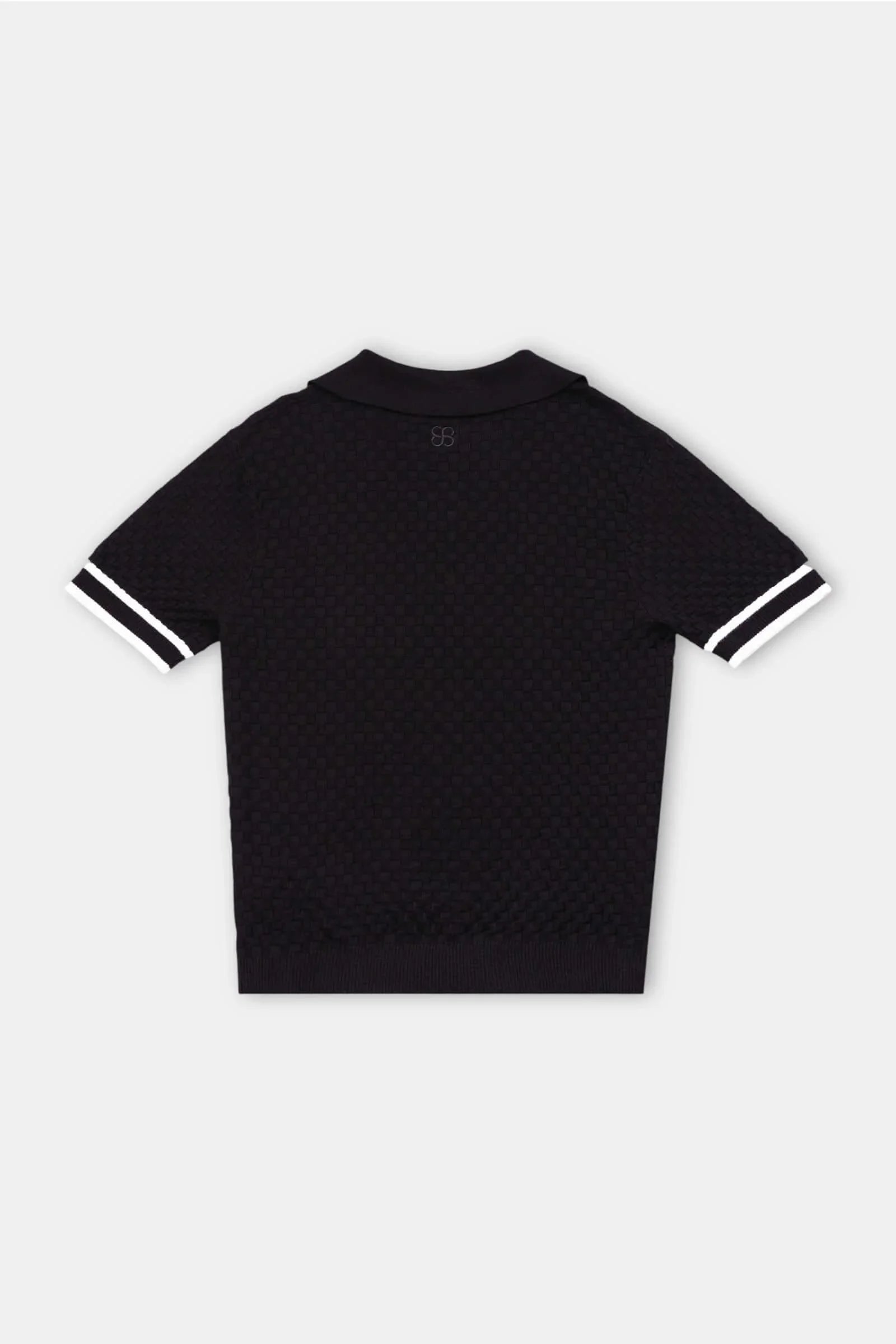 Checkered Polo – black and cream knit back view flat lay