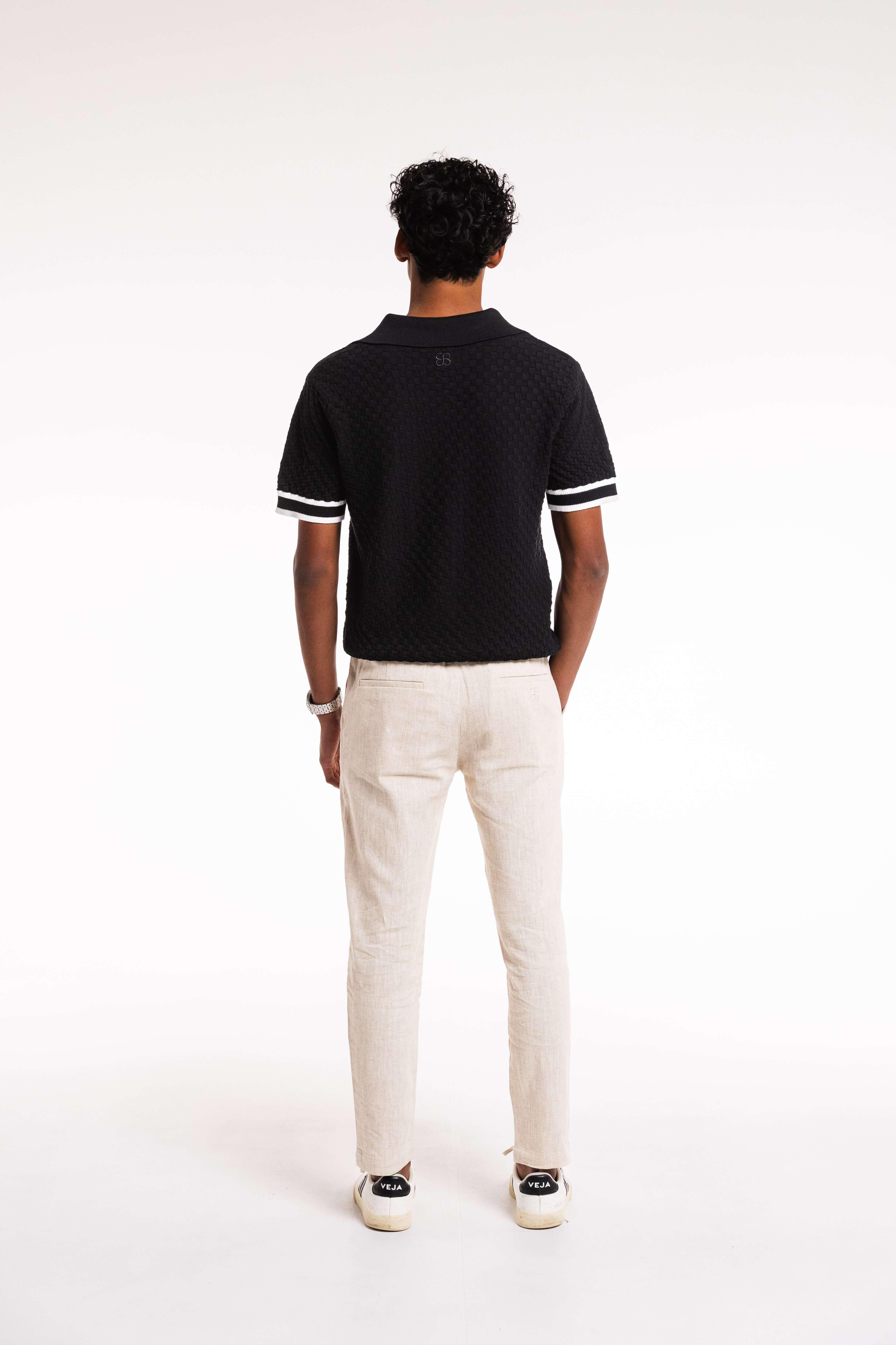 Back view of Checkered Polo showing fit and ribbed hem