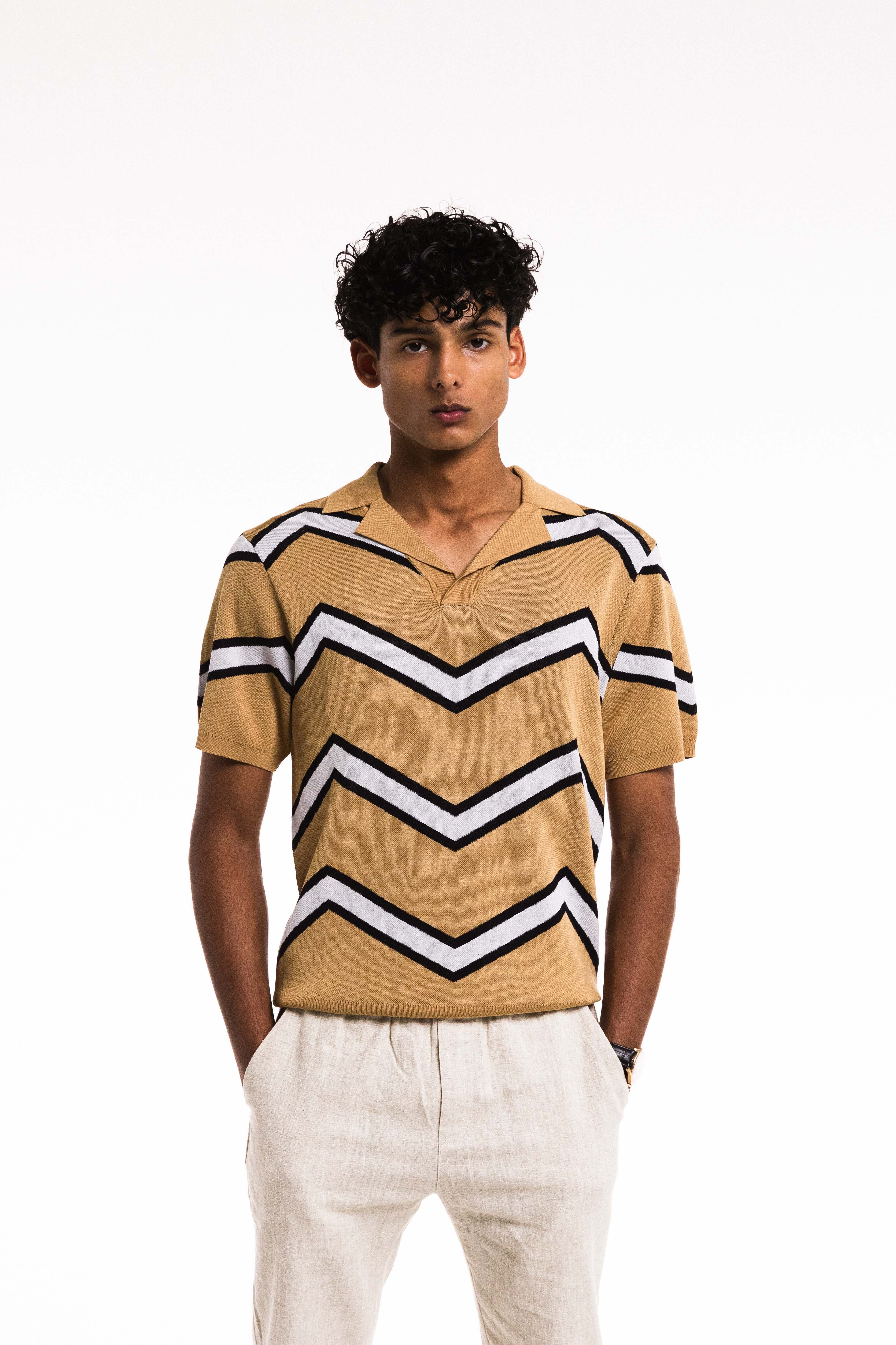 Model wearing Chevron Polo in Caramel in natural light – relaxed pose close