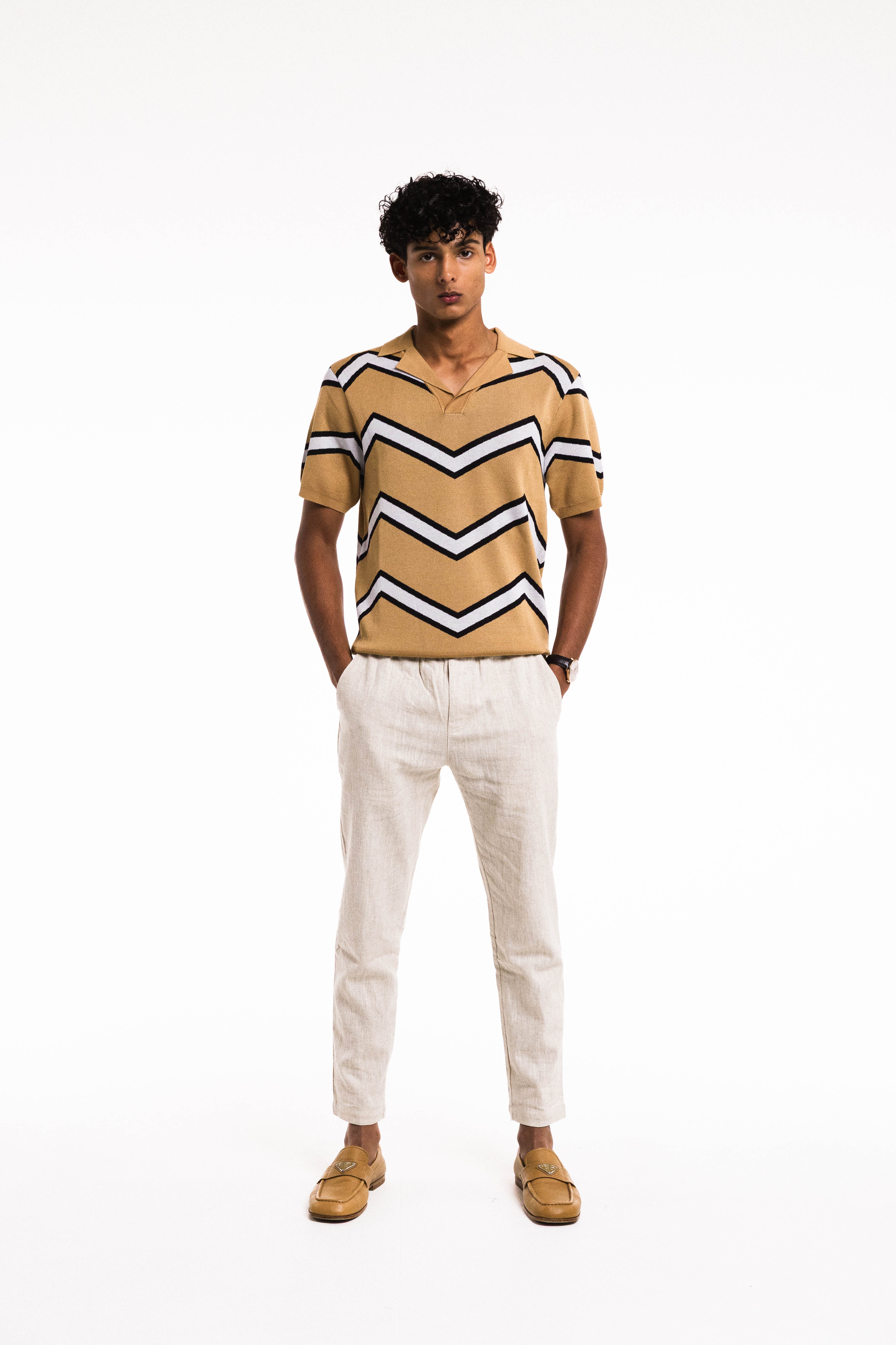 Model wearing Chevron Polo in Caramel in natural light – relaxed pose