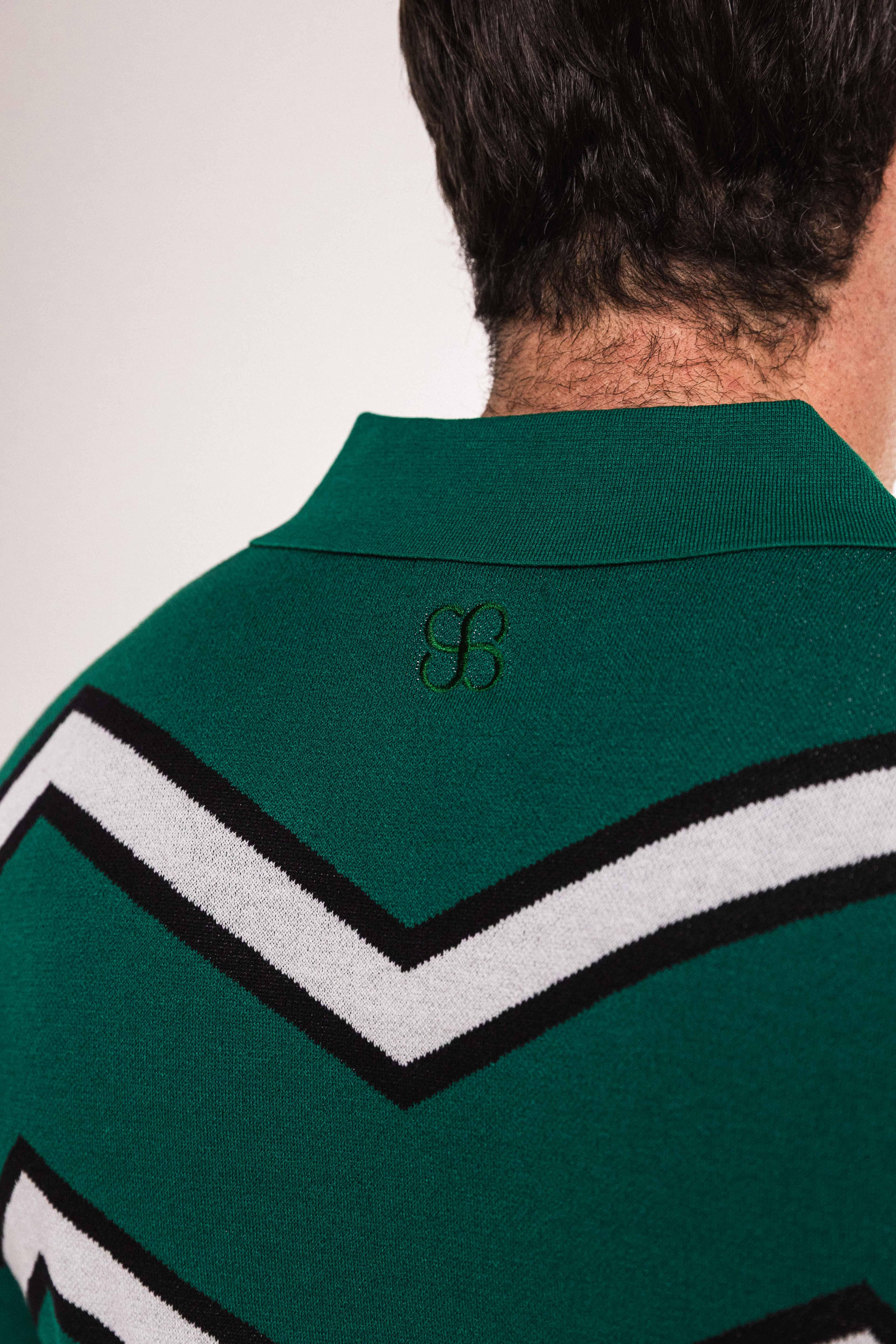 Back view of the Chevron ZigZag Polo showcasing the bold zigzag design and embroidered logo in forest green.