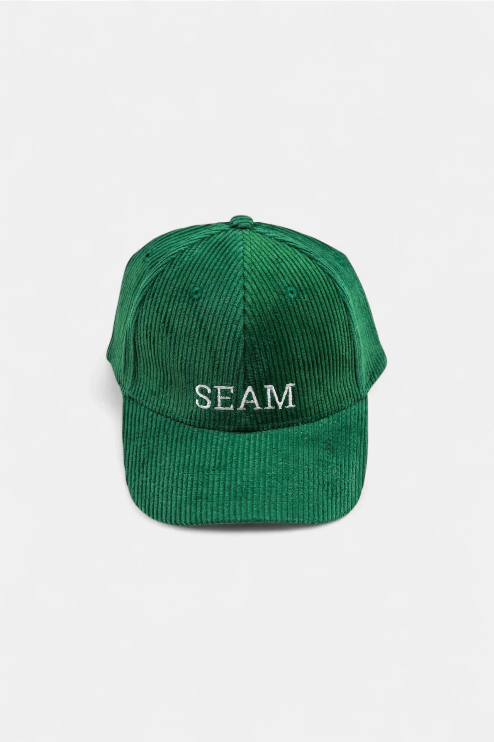 Seam Corduroy Logo Hat in forest green featuring embroidered front detail and structured six-panel design.