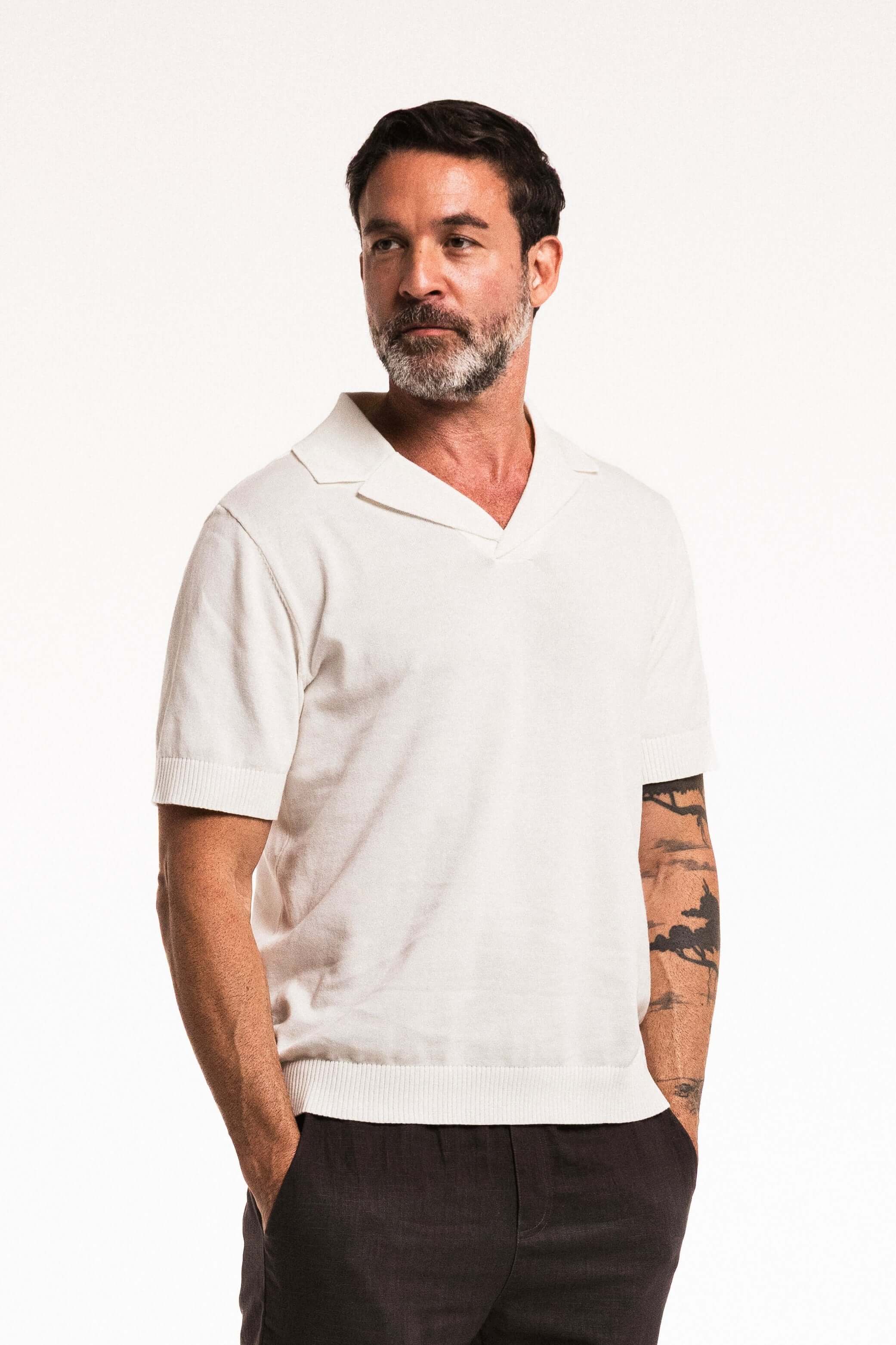 Classic Cotton Knit Polo in Ivory on a model showcasing a stylish and textured design for versatile everyday wear.