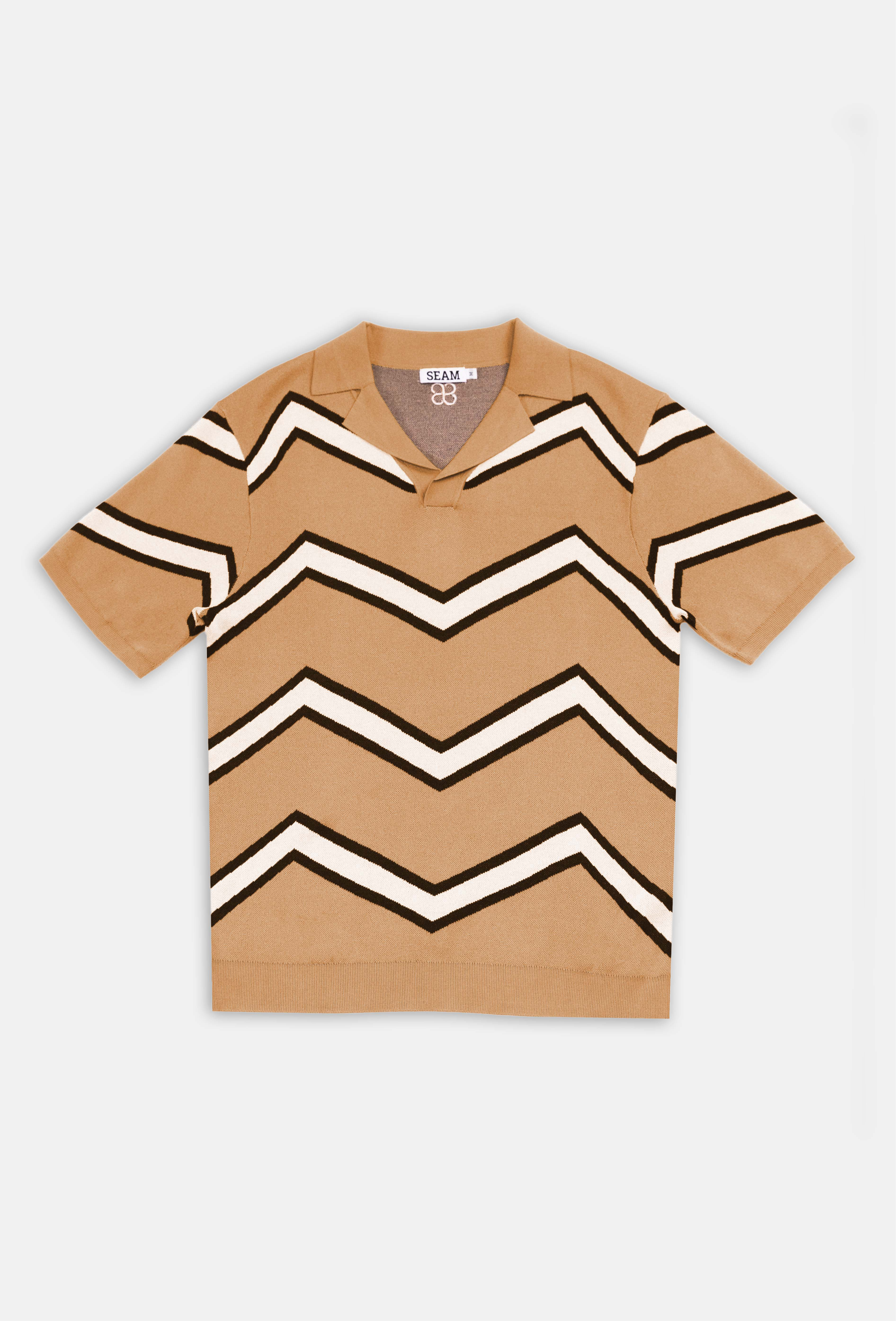 Beige shirt with black and white zigzag pattern on a white background