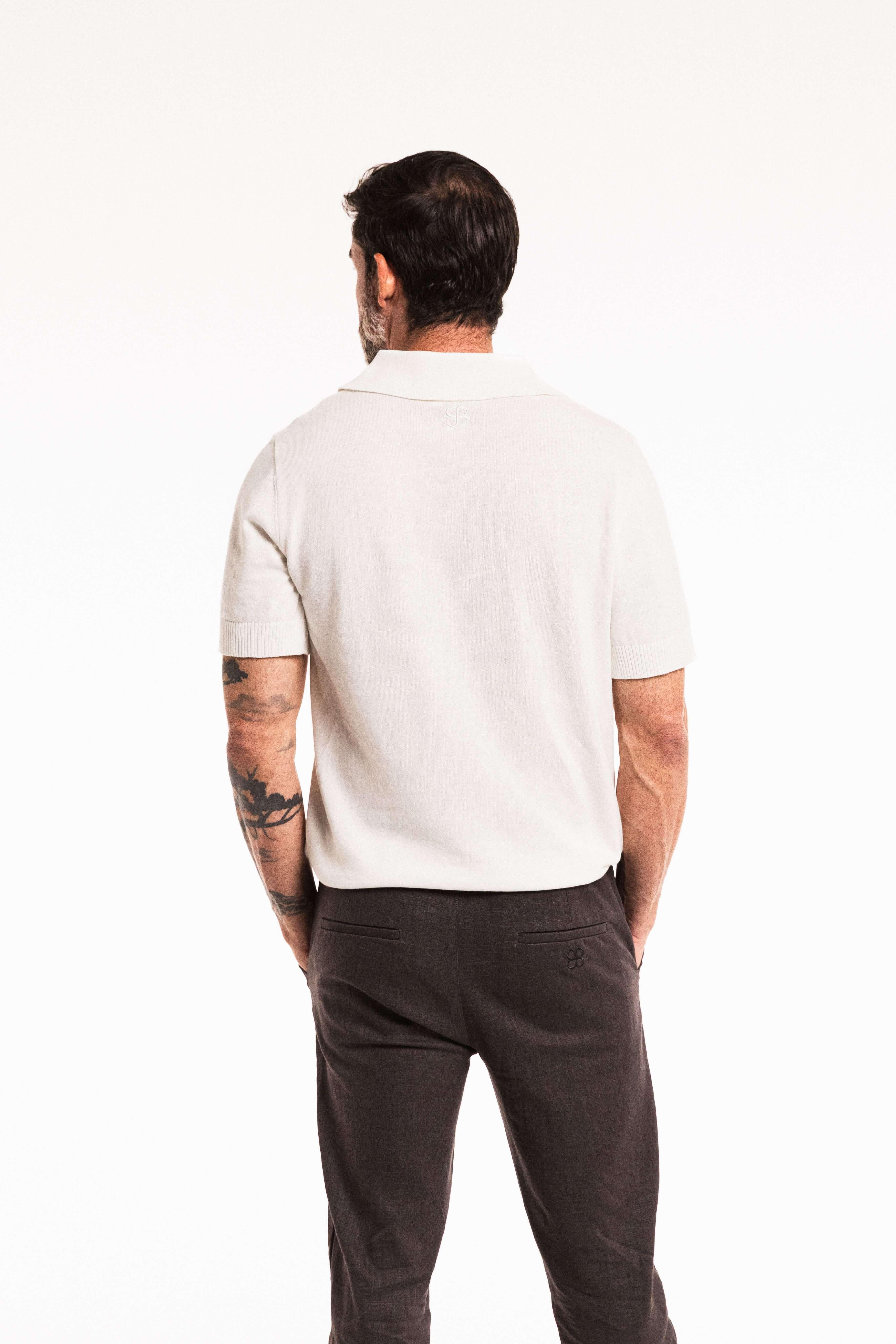 Close-up back view of model wearing Classic ivory Polo – ribbed collar and knit texture