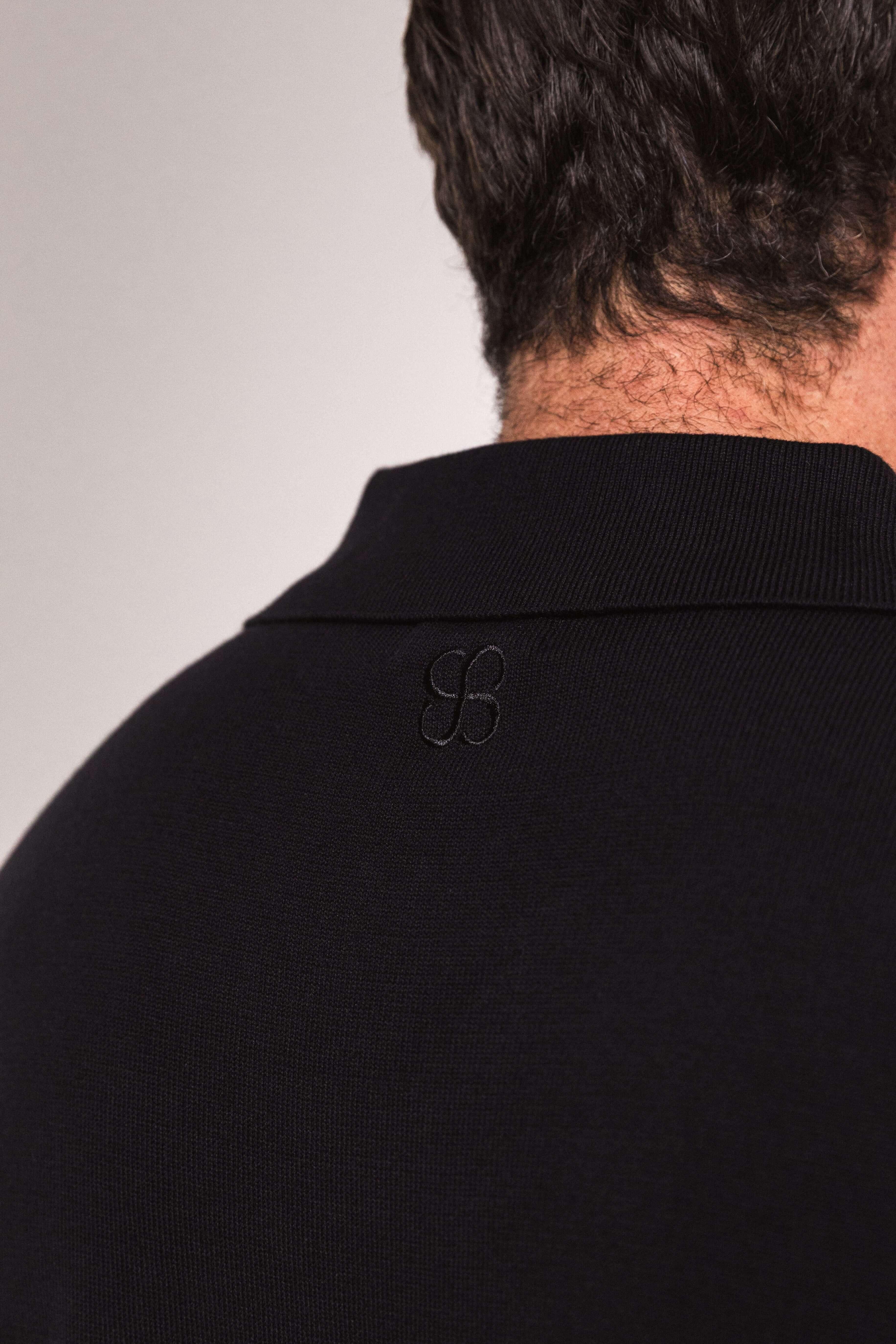 Close-up of black textured knit fabric – Classic Polo in Obsidian