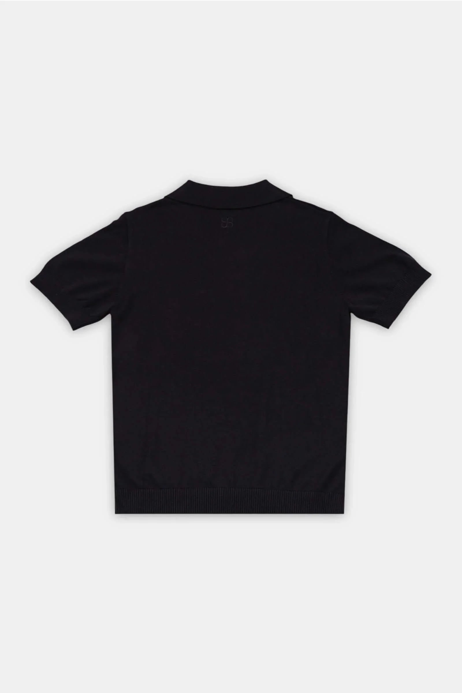 Flat lay of Classic Polo in Obsidian – back view showing tailored structure