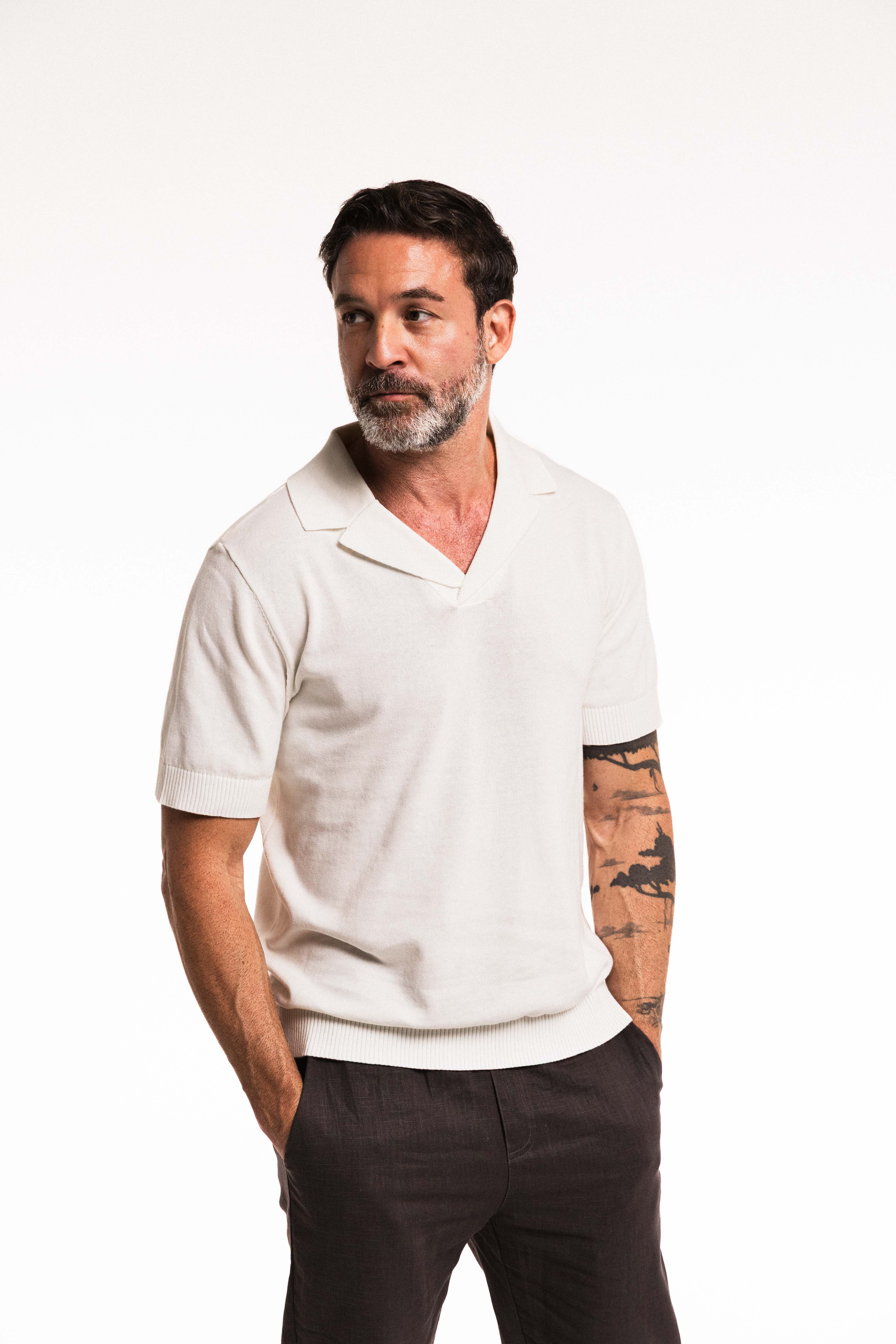 Close-up of model wearing Classic Ivory Polo – ribbed collar and knit texture